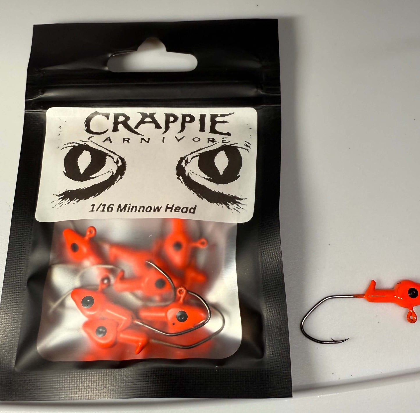 Minnow Jig Head 10/Pack in Blaze Orange color, 1/16oz with sickle style #2 hook, ideal for fishing.