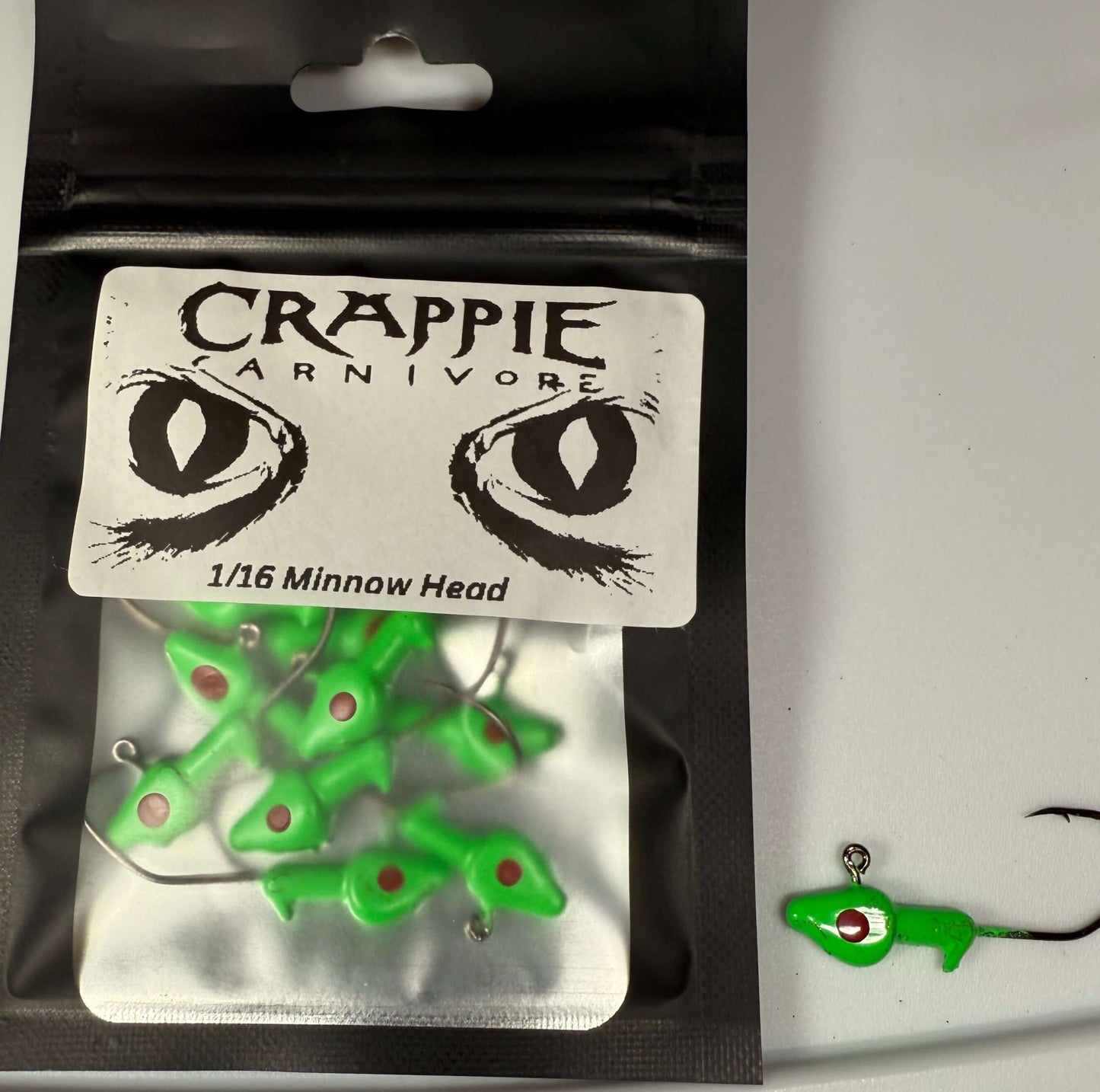 Bright green Minnow Jig Heads 10 pack, 1/16oz with sickle style hooks for fishing tackle.