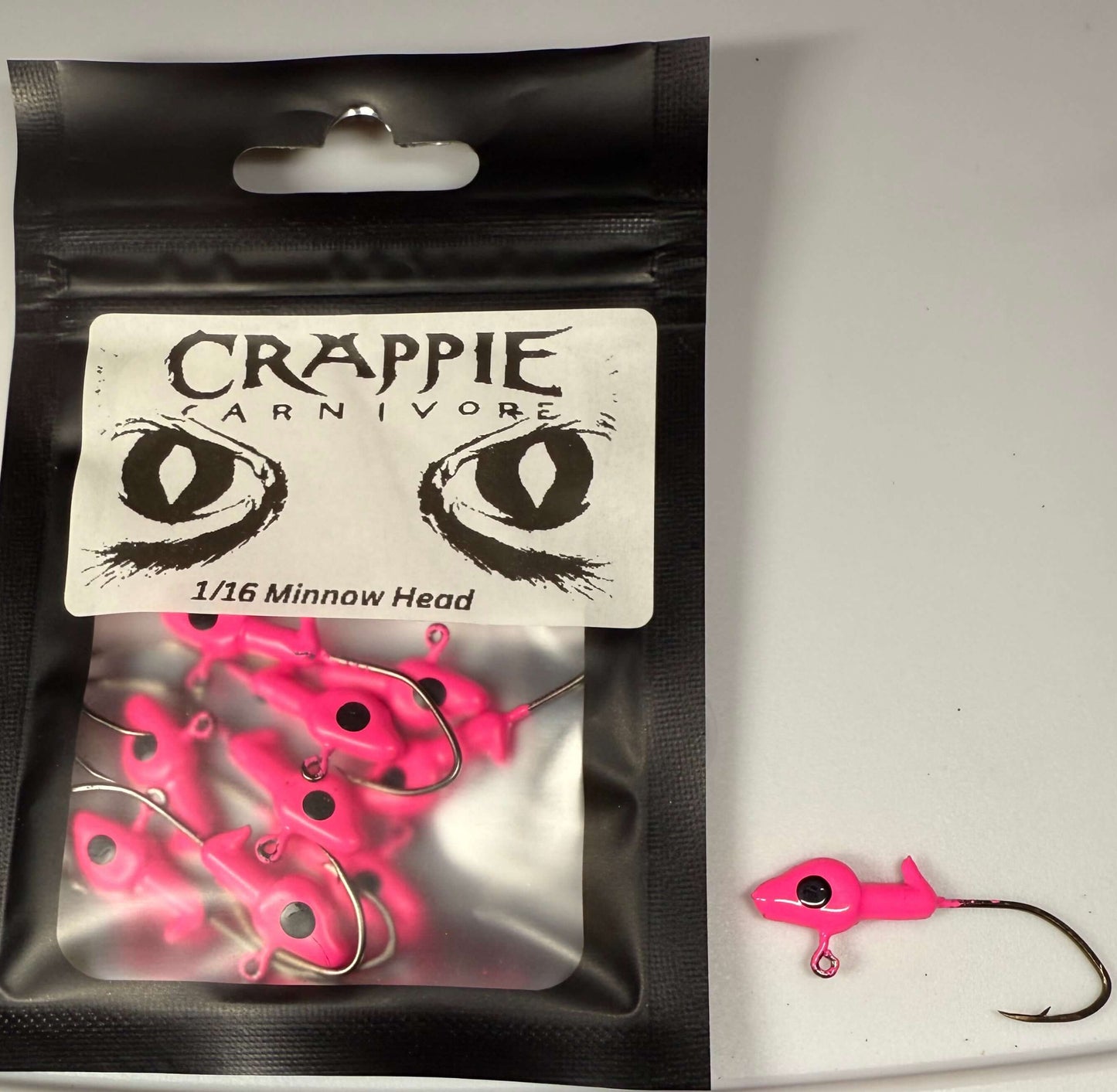 Minnow Jig Head pack in hot pink color with #2 sickle style hook, ideal for fishing, 1/16oz size.
