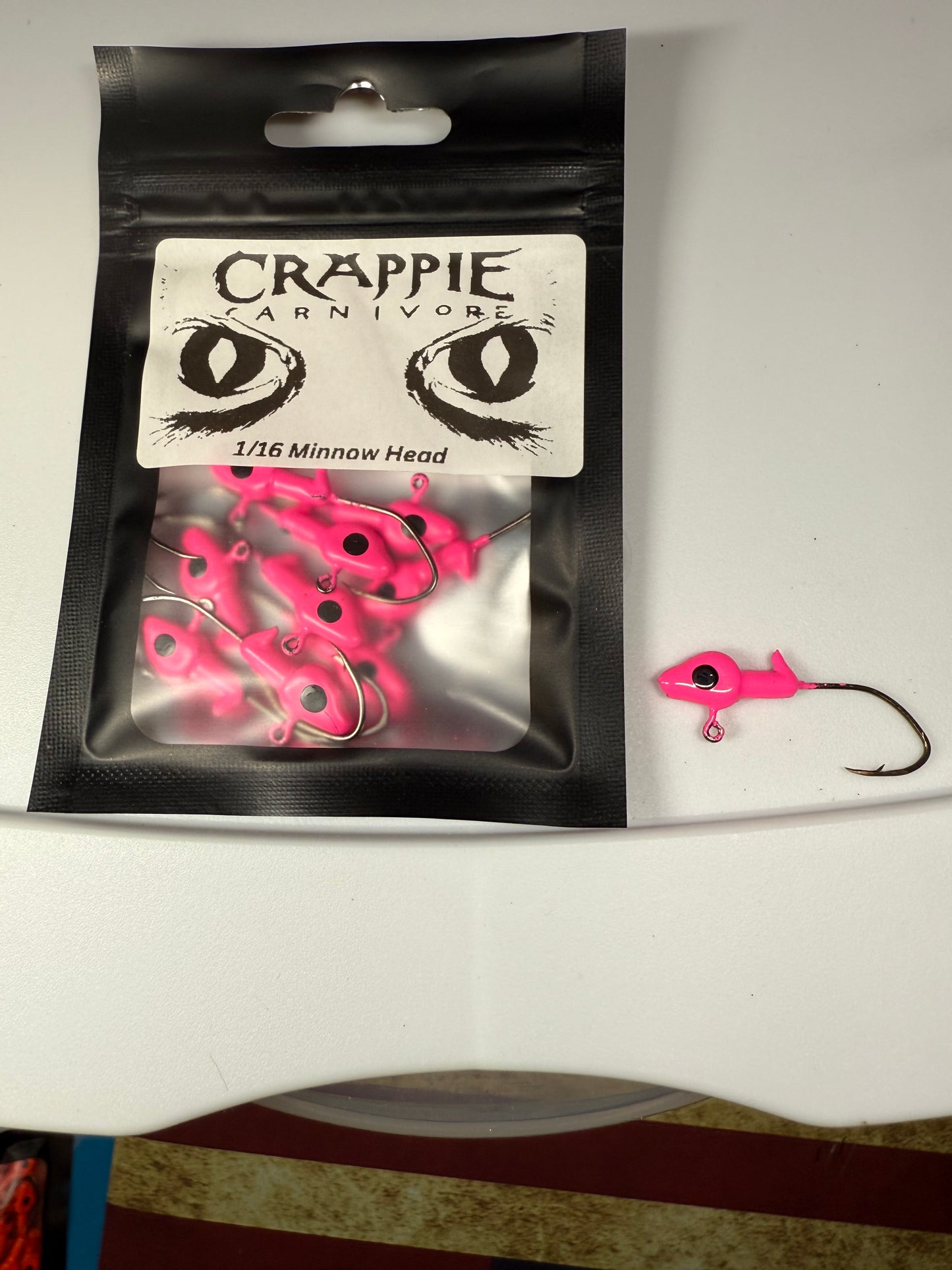 Minnow Jig Head pack in hot pink color with #2 sickle style hook, ideal for fishing, 1/16oz size.